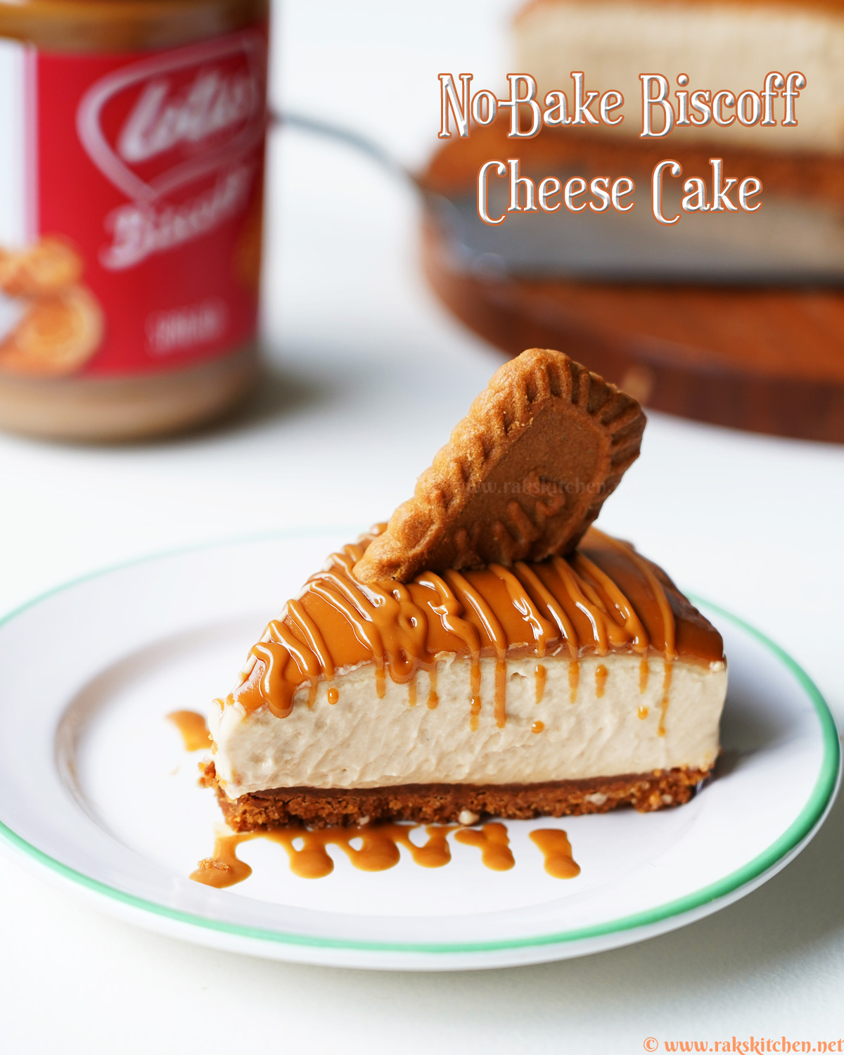 A slice of biscoff cheesecake with a drizzle, biscuit on top
